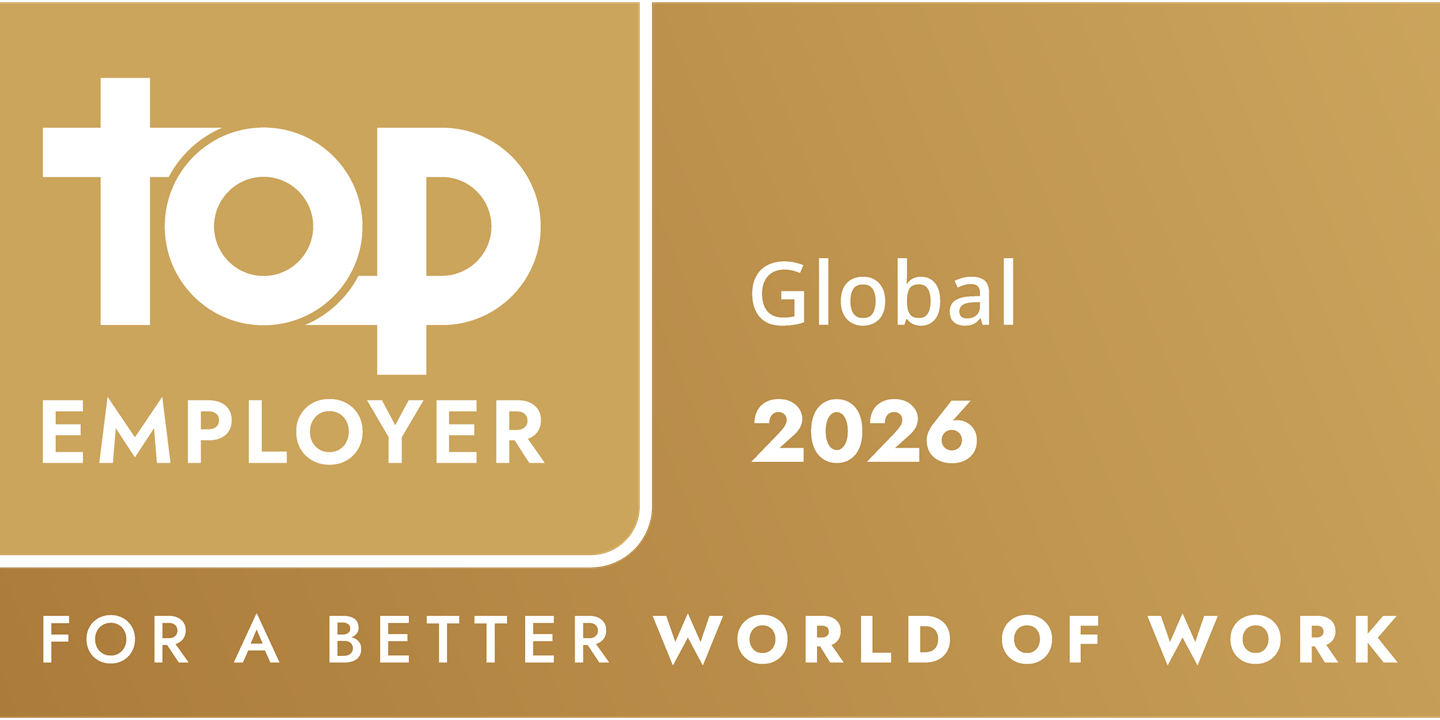 Gold plaque with Top Employer Global 2025 text, featuring a stylised top logo. Below, it reads For a Better World of Work. The background has a gradient of darker to lighter gold tones.