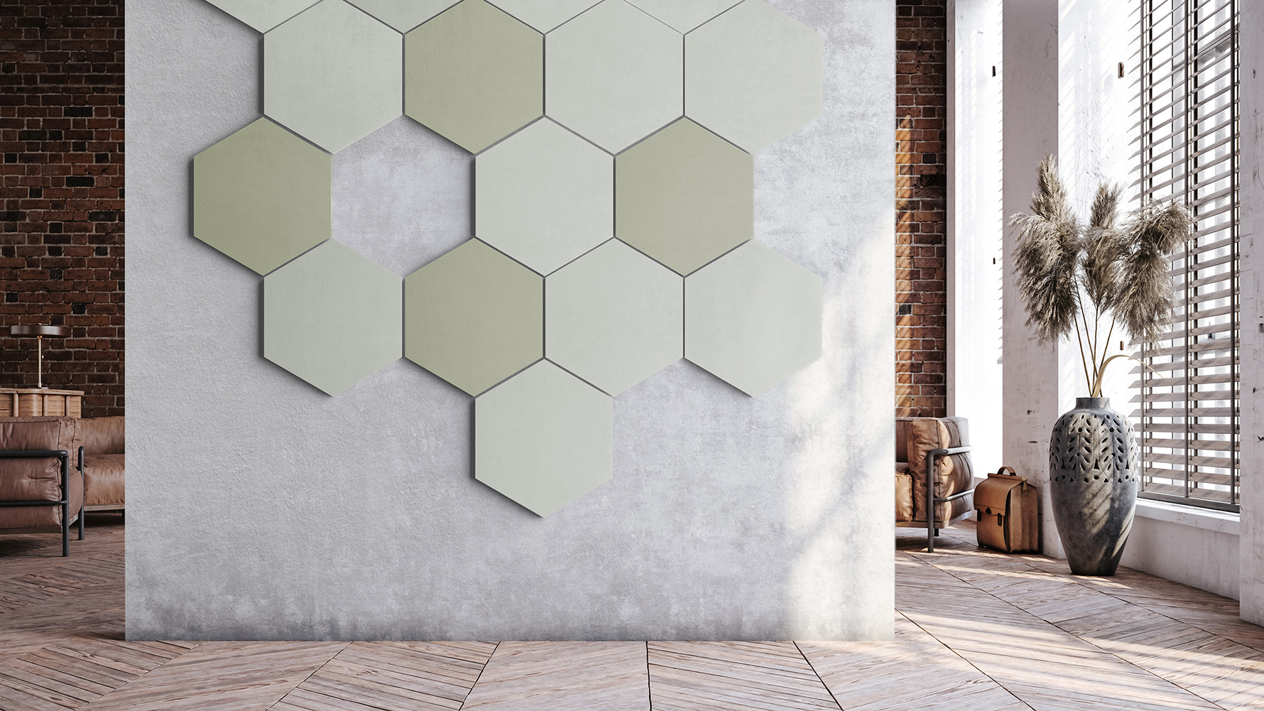 Hexagonal acoustic wall panels in soft green and light grey tones arranged in a geometric pattern on a concrete wall in a modern, sunlit interior.