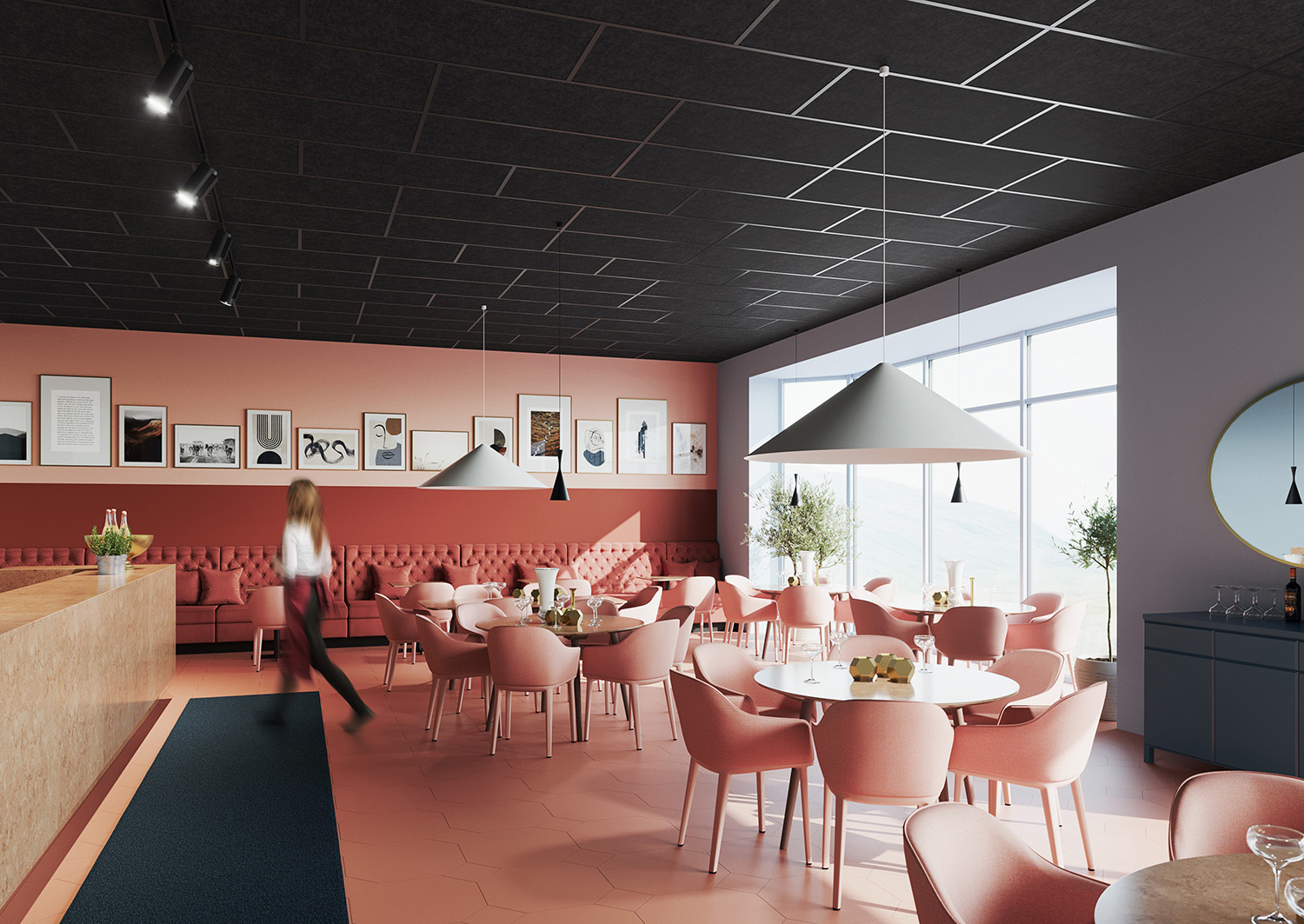 A modern café with pink chairs and tables, a long pink cushioned bench, pendant lights, framed art on pink walls, large windows with daylight, and a person in motion near the counter.