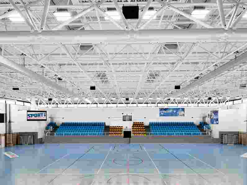 Suspended acoustic ceiling in sports hall