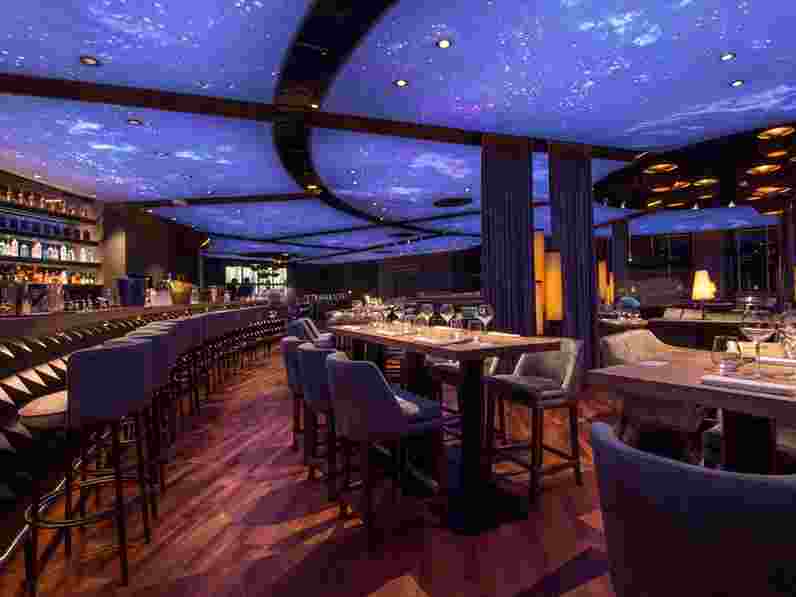 Restaurant with acoustic stretch fabric ceiling