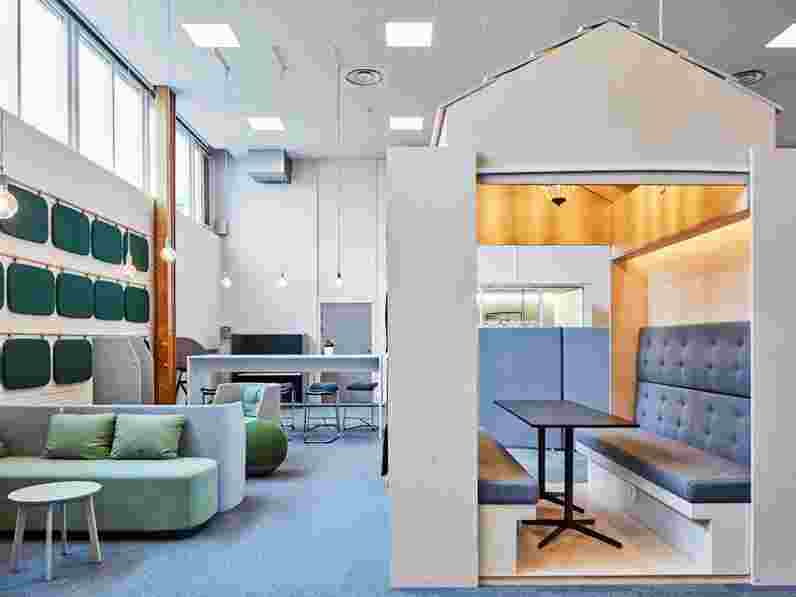 Open-learning area with suspended acoustic ceiling.