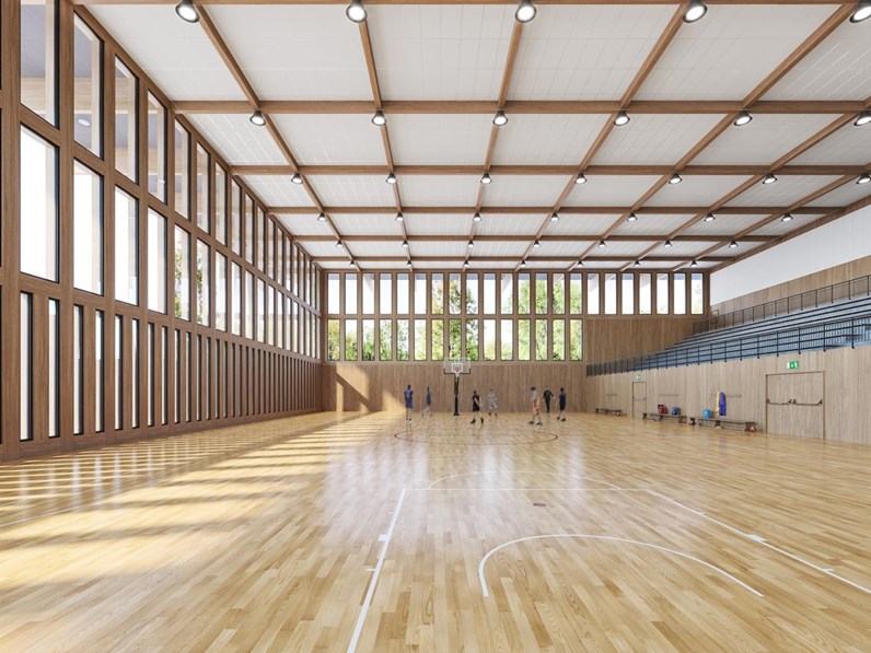 Large sports hall with white acoustic ceiling system