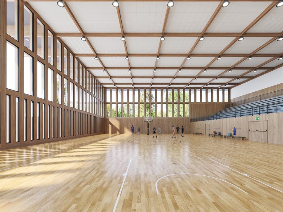 Large sports hall with white acoustic ceiling system
