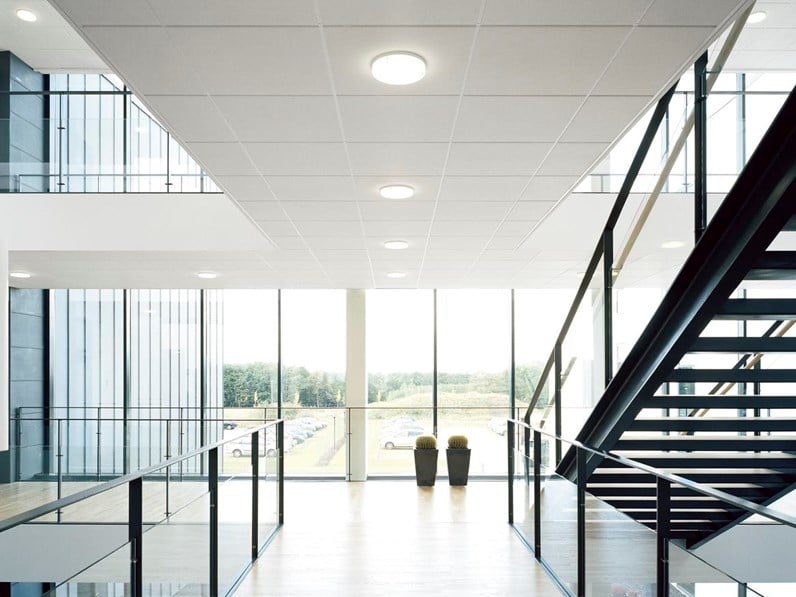Suspended acoustic ceiling system Ecophon Gedina E with semi-concealed grid in office open space