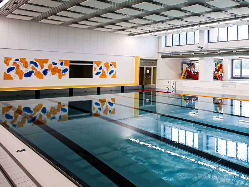 Acoustic wall panels in swimming pool area