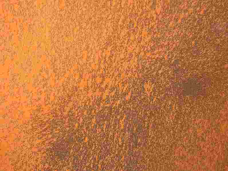 Close-up of acoustic plaster with rust appearance