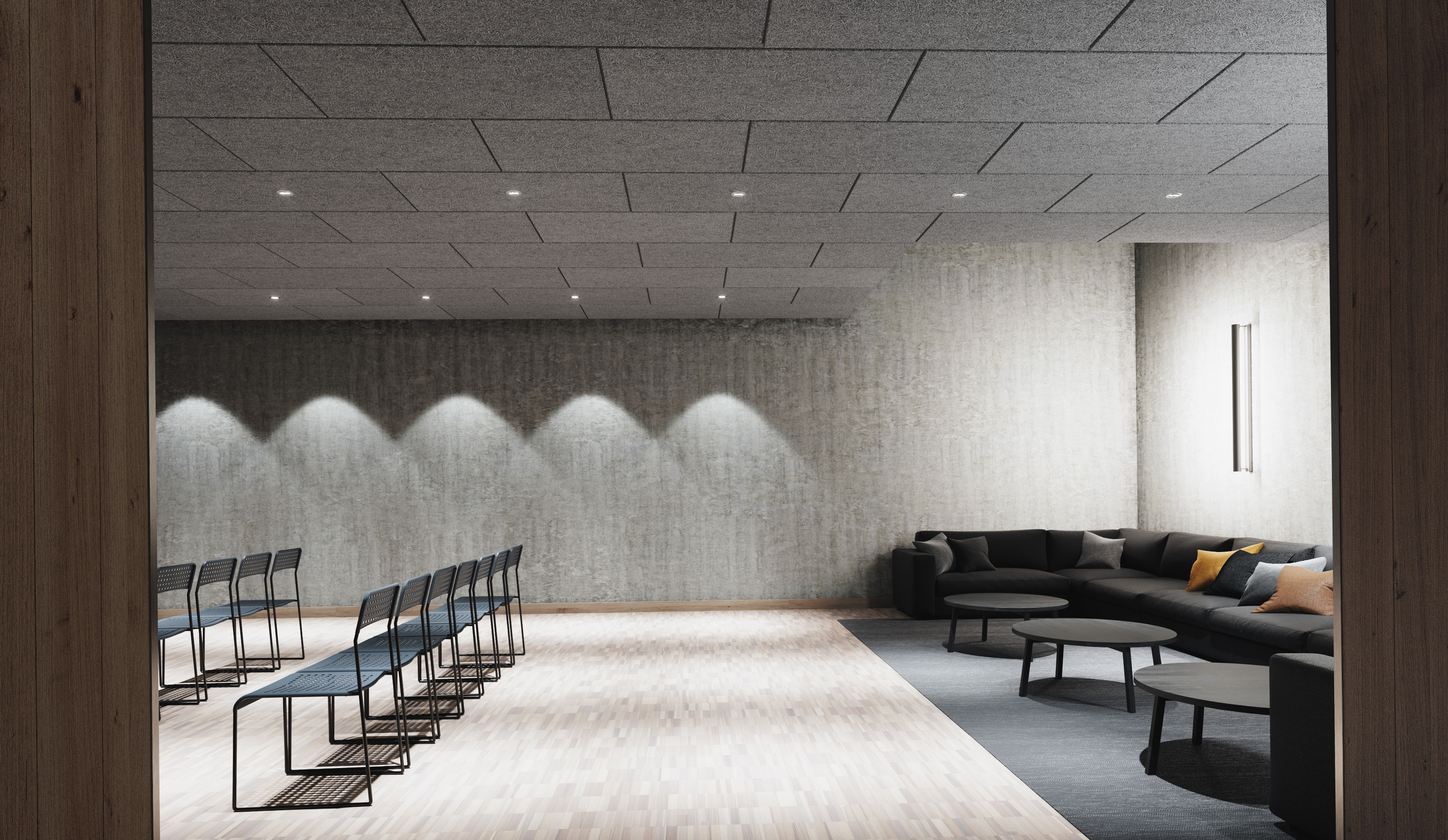 Grey, acoustic wood wool ceiling in conference room with chairs in rows and a corner sofa and three coffee tables at the back of the room