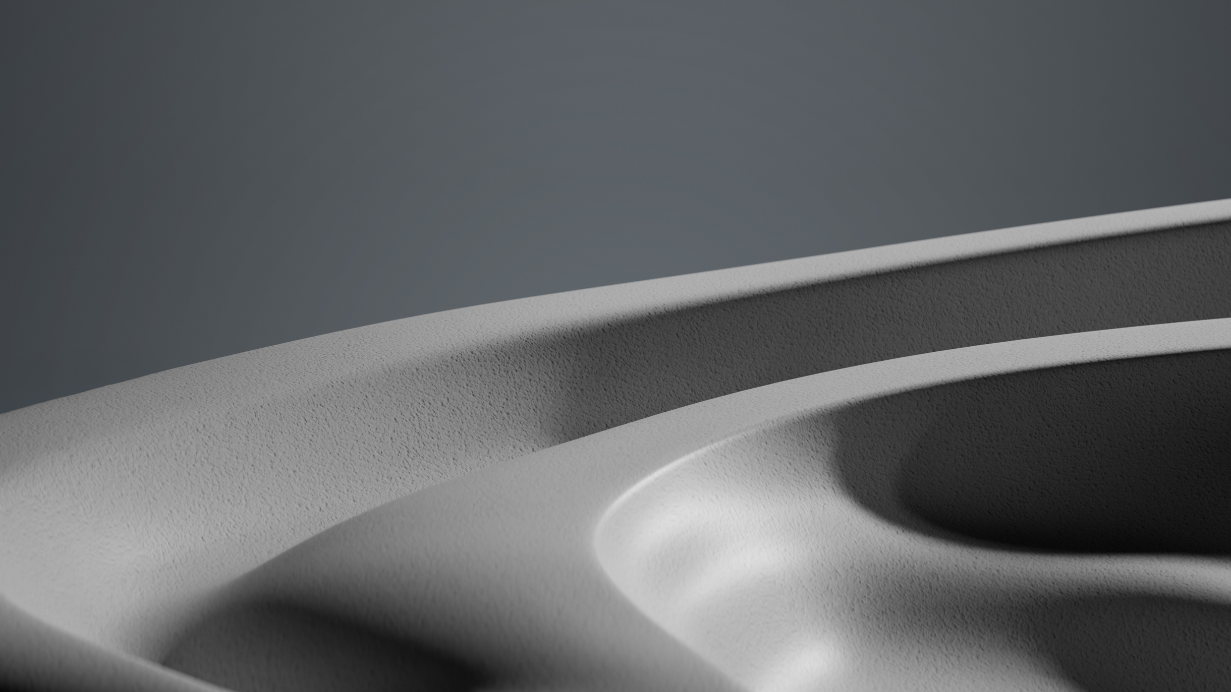 Close-up view of a smooth, curved surface with subtle gradients of light and shadow, creating an abstract monochromatic landscape.